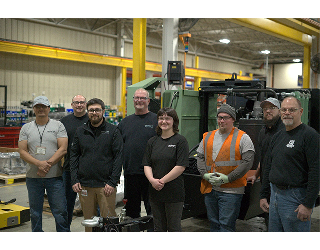 Hitachi Global Air Power employees on compressor assembly line